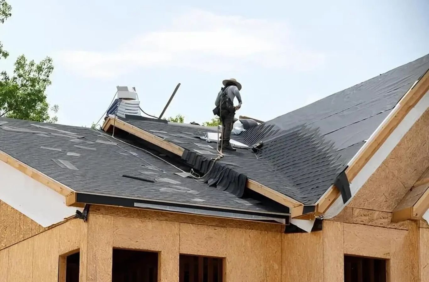 Century Exteriors roofer installs shingles in Smyrna TN using a safety harness to deliver professional Roofing Company service.